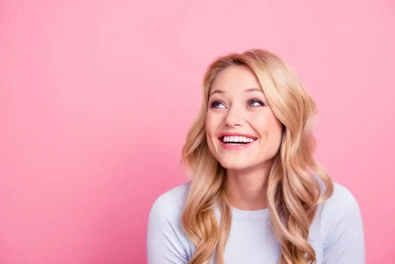 Young woman smiles at Pediatric Dentistry and Orthodontics of Forsyth - Cumming in Cumming, GA.