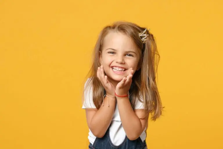 Young patient smiles at Pediatric Dentistry and Orthodontics of Forsyth - Cumming in Cumming, GA.