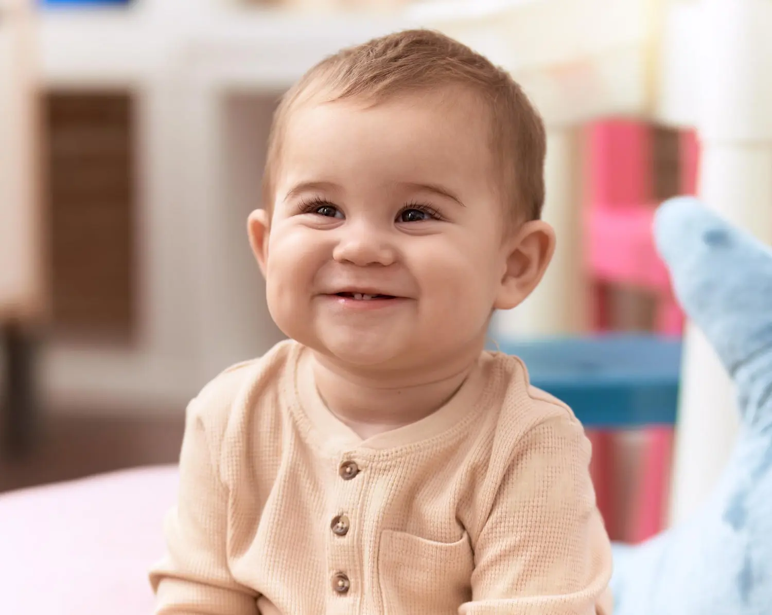 A baby smiling, emphasizing the importance of restorative dentistry or Space Maintainers for Missing Baby Teeth for children at Pediatric Dentistry and Orthodontics of Forsyth - Cumming in Cumming, GA.