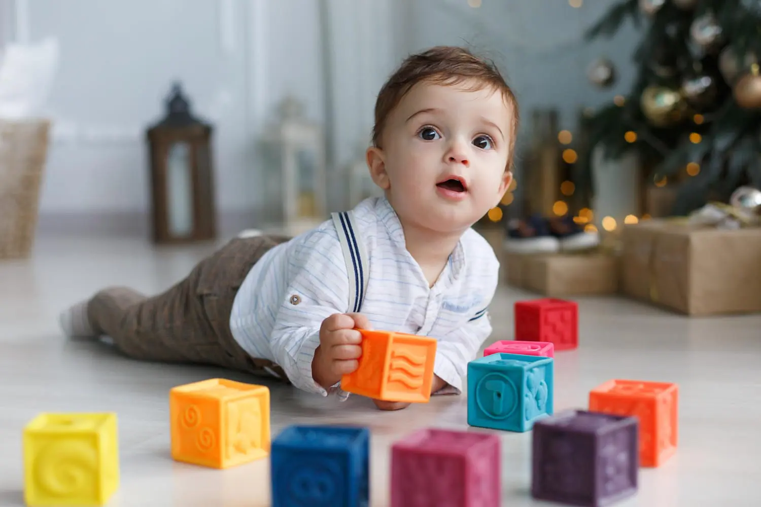 With this image of a baby in lying on a floor, it's illustration about Learn about Baby Thumb-Sucking & Pacifier Guidance with Baby Dentist at Pediatric Dentistry and Orthodontics of Forsyth - Cumming in Cumming, GA.