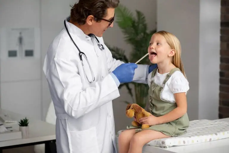 A dentist with patient at Pediatric Dentistry and Orthodontics of Forsyth - Cumming in Cumming, GA.