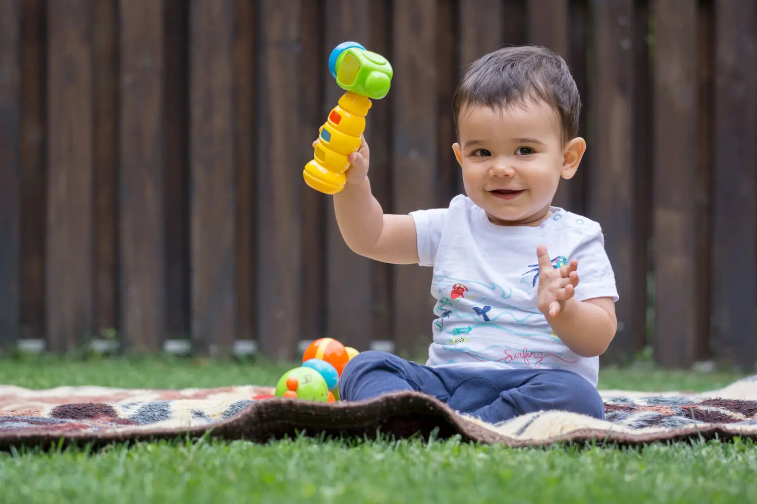 Baby dentist reminding parents about oral hygiene for babies and toddlers with shares an image of a baby hold a toys. Pediatric Dentistry and Orthodontics of Forsyth - Cumming maybe solution for give oral hygiene for babies in Cumming, GA.