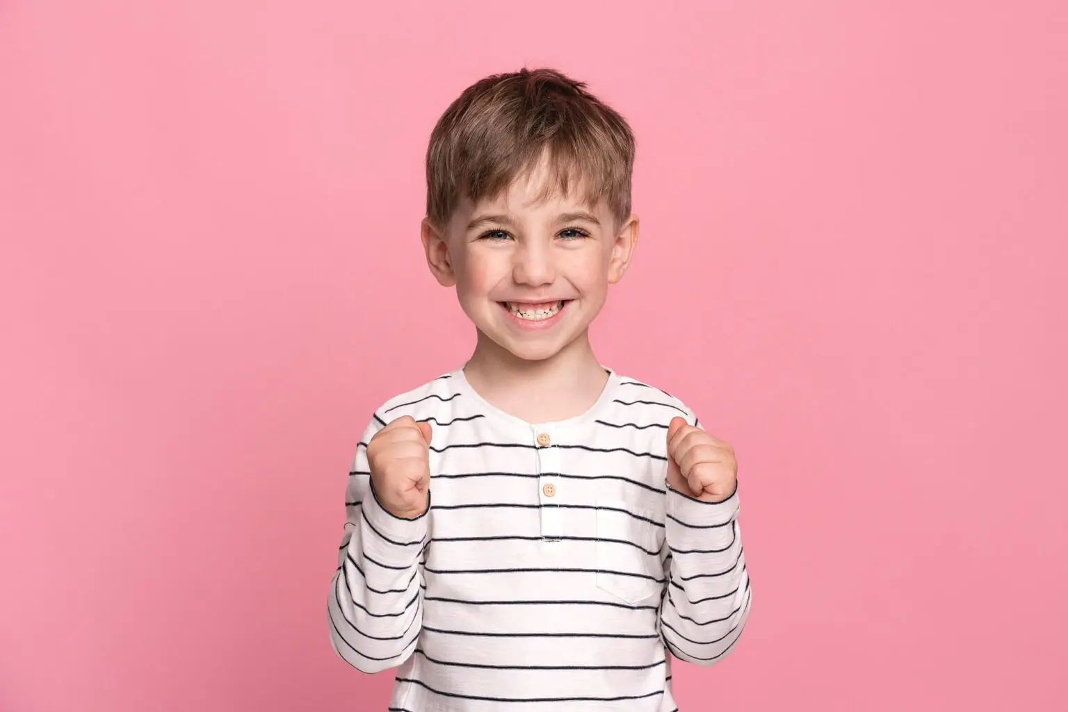 A young boy smiles, represent Apple Health Covers Special-Needs Dentistry available at Pediatric Dentistry and Orthodontics of Forsyth - Cumming in Cumming, GA.