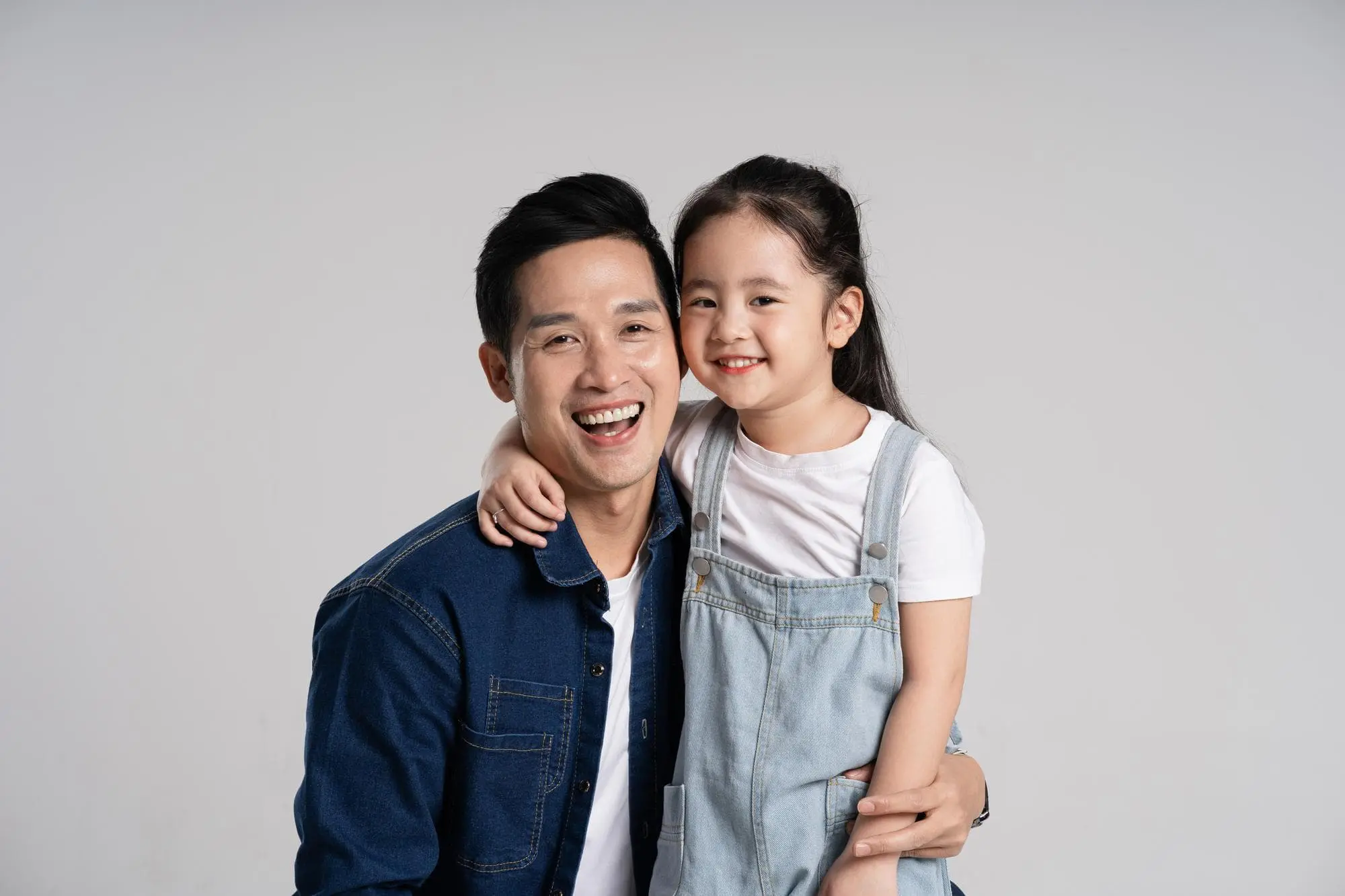 Smiling after learning about orthodontic costs at Forsyth Pediatric Dentistry and Orthodontics in Cumming, GA.